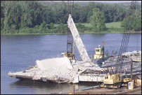 Barge Removing Final Beam from Bridge