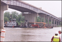 Coast Guard Barge Moving Under Bridge