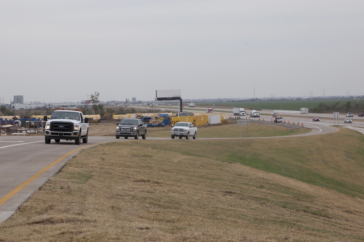 Traffic drives on the new westbound I-40 off-ramp to Radio Rd. Nov. 3, 2016, after a dedication ceremony.