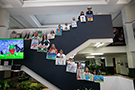 small image of 2019 student winners standing on the main staircase inside the odot building