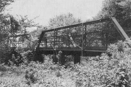 Bridge 06N2640E0620008, located near Okeene, is an uncommon two span Pratt half-hip pony truss.