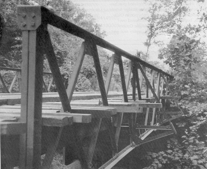 Bridge 54N3900E1180003 is Oklahoma's only double-intersection Warren pony truss.  Okfuskee County acquired this riveted span in 1910.  Visible in the photograph are outriggers which strengthen the floor beams.