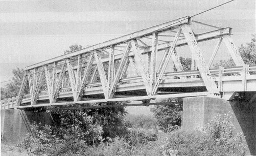 Bridge 40N4580E1600004 is a pinned Warren through truss spanning the Kiamichi River in mountainous southeastern Oklahoma.