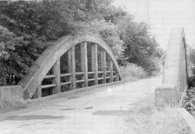 Bridge 63N3410E1180003 is Oklahoma's only concrete rainbow or through arch.  It is located between Shawnee and Tecumseh in Pottawatomie County.