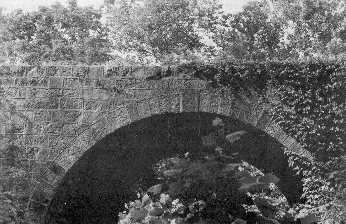 A depression-era project which employed Cherokees from the area, Bridge 49E0610N4390007 is a stone arch south of Locust Grove in Mayes County.