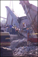 Workers Clearing Debris from Barge