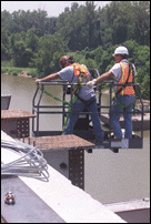 Men Preparing Steel for Reconnection