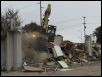 Remining stroe wall being ripped down