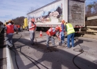 Workers repairing a hole in the bridge deck on State highway 60 over the vertigris river.