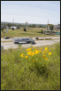 Traffic on I-35 passes wildflowers that were part of ODOT’s roadside beautification program